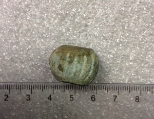 Corroded faience bead. It used to be completely turquoise.